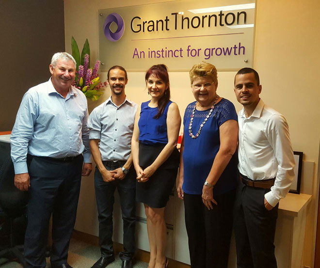 Jesse with staff at Grant Thornton's office