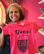 Sally Scales from Tjanpi. As well as artworks, Tjanpi sells a range of merchandise.