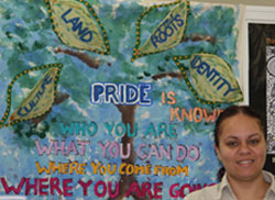 Thelma Phillips with 'pride, land, roots' banner
