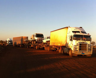 Loaded trucks going out to the Lands.