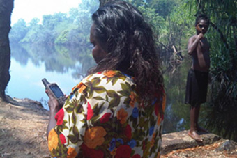 Karrabing family members in country using mobile phones to track one another. Photo: Karrabing Indigenous Corporation