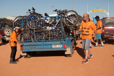 Photo: Loading the bikes: Each year UTHSAC runs COBRA (Coober—Oodnadatta Bike Ride Adventure). Over three days, 10 males and 10 boys with a support crew ride mountain bikes some 200 kilometres. Along the way they camp, enjoy the outdoors, learn about culture and discuss important matters, such as how to stay healthy and happy, and how to find direction in life. Photo courtesy UTHSAC