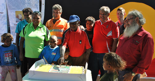 photo of community cutting the cake