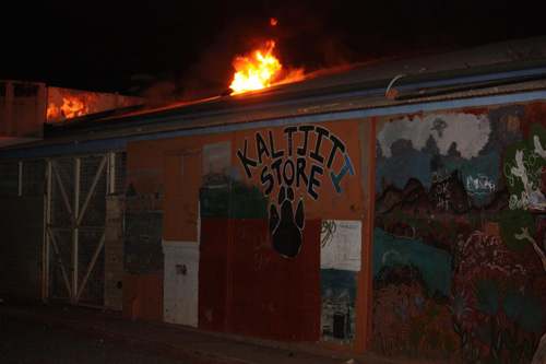 Kaltjiti store on fire. Flames coming out from the roof of the store.