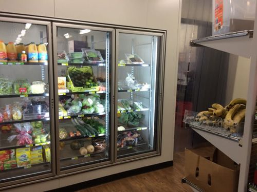 fridge displaying fresh produce and juice in the kaljitti store