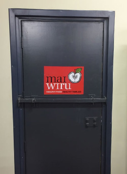 Mai Wiru logo on the door in Kaljitti store