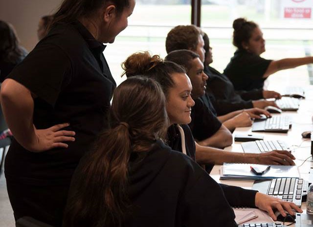 A row of Aboriginal students in a computer lab 