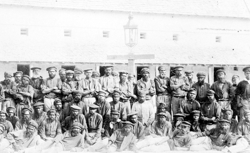 Large group of Aboriginal prisoners arranged for a photograph in The Quod, 1892