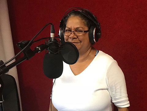 Dorrie-Anne Raymond, member of Larrakia Nation Aboriginal Corporation, recording promotions for a family fun day to celebrate the corporation's 20th anniversary