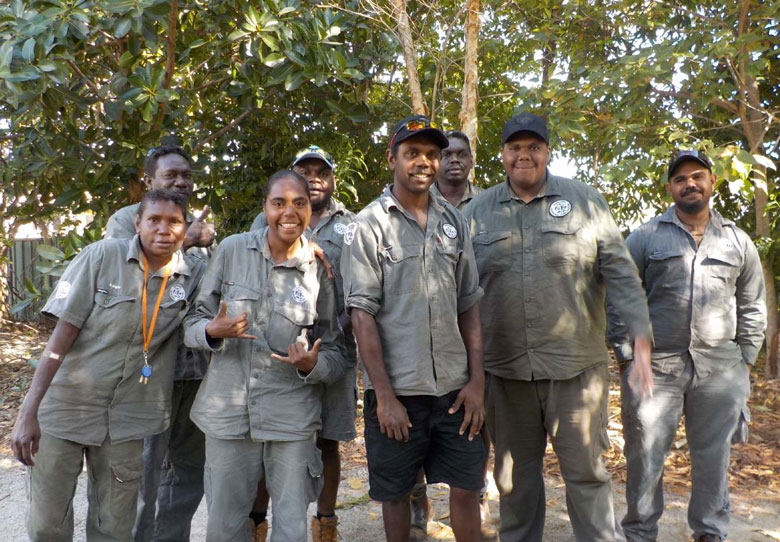 Eight Dhimurru rangers posing for the camera in Nhulunbuy, northeast Arnhem Land