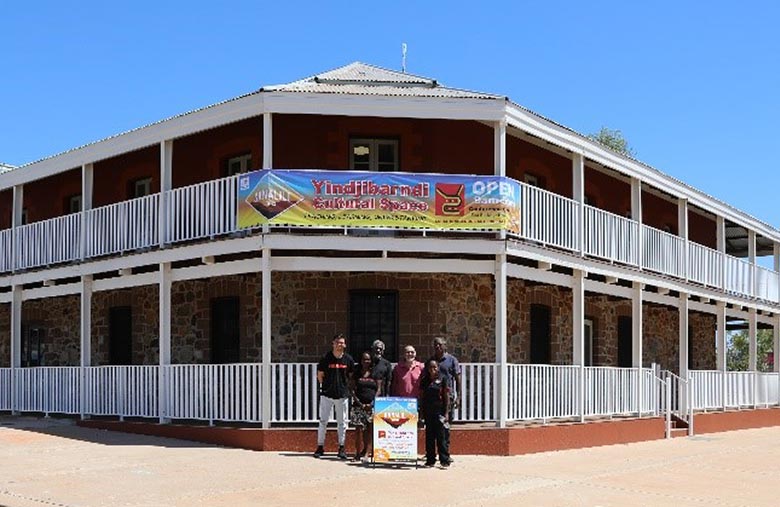 Entrance to Ganalili Centre, the new incarnation of the old Victoria Hotel in Roebourne, with directors of Yindjibarndi Aboriginal Corporaiton RNTBC in the foreground