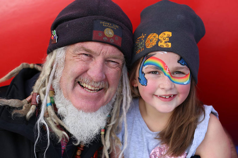 Man and girl celebrating 30 years of Karadi Aboriginal Corporation
