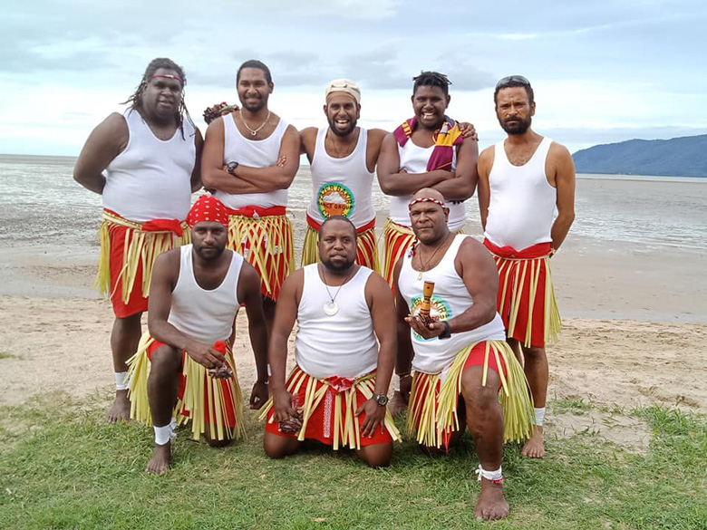 Group of eight Torres Strait Islander dancers