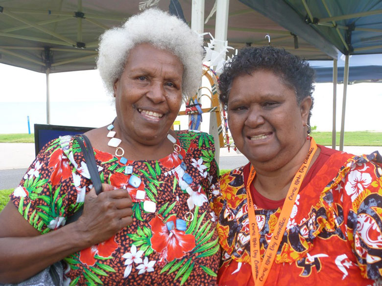 Two Torres Strait Islander women smiling to camera