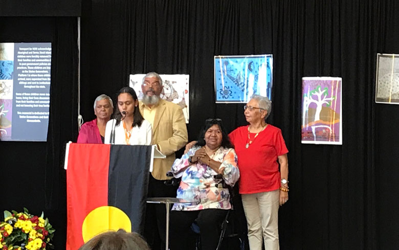 Five people on stage to open the memorial to the Stolen Generations at Sydney Central railway station
