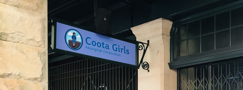 Sign outside the Sydney Central Station office for Coota Girls Aboriginal Corporation