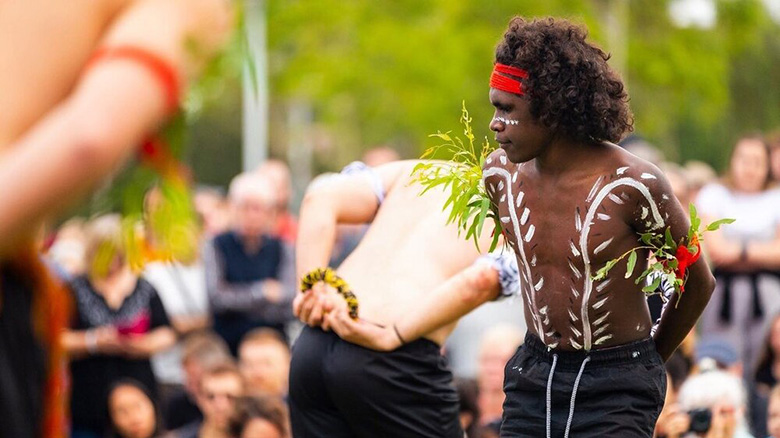 Young Anangu man dancing in a ceremony