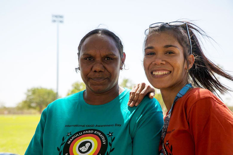 Young Aboriginal women marching to raise awarenss of foetal alcohol syndrome disorders