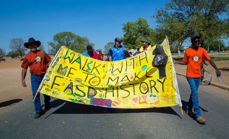 Aboriginal people marching to raise awareness of foetal alcohol syndrome disorders