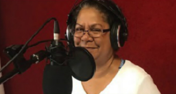 Dorrie-Anne Raymond, member of Larrakia Nation Aboriginal Corporation, recording promotions for a family fun day to celebrate the corporation's 20th anniversary