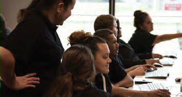 A row of Aboriginal students in a computer lab