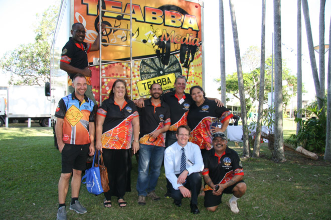 TEABBA staff and the Registrar of Indigenous Corporations in front of TEABBA's outside broadcasting bus