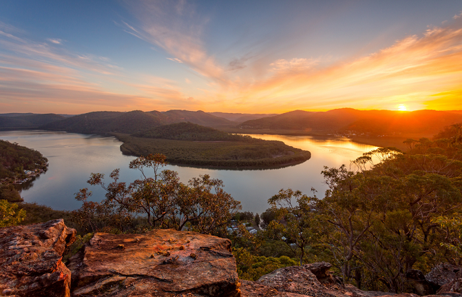The sun sets over a bend of the Hawkesbury River