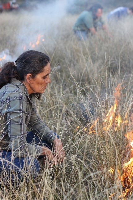 Sharon Riley helps out with a cultural burn near Lithgow. Photo: Mingaan Wiradjuri Aboriginal Corporation.