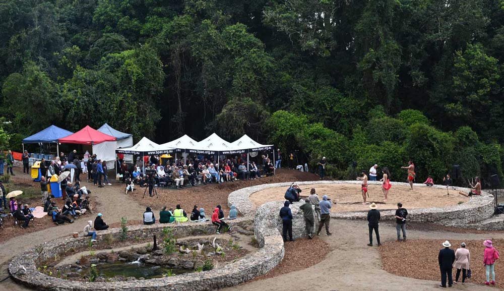 Large group of people spread around a sculptural landscape in the Bunya Mountains