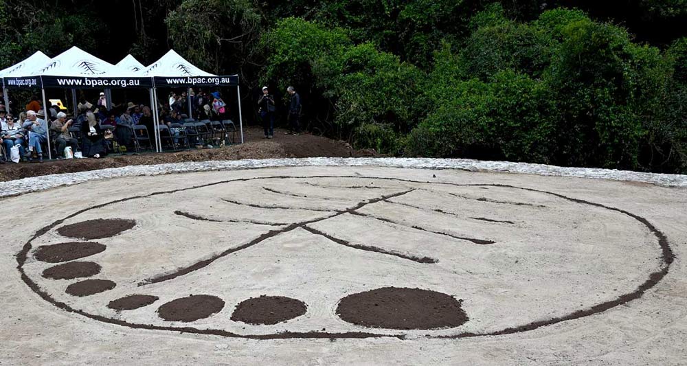 Sand pit prepared to show a bunya tree design from the air