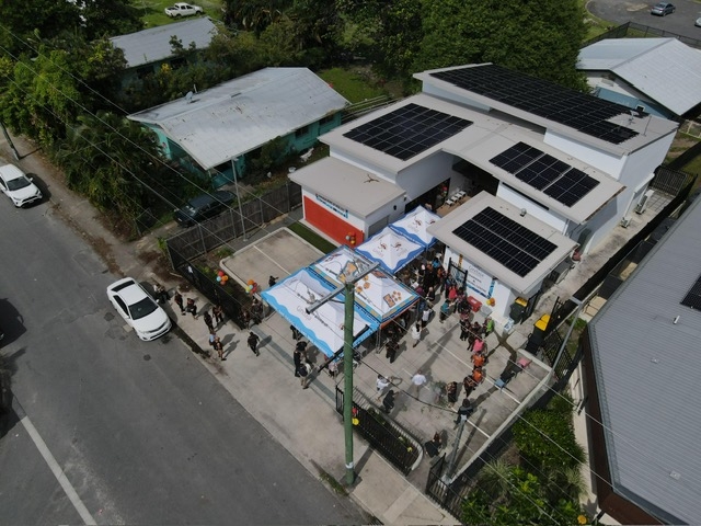 An aerial view of a building on an urban street