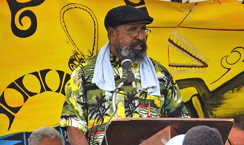A man speaks into a microphone