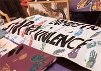A hand-painted banner with handprints.